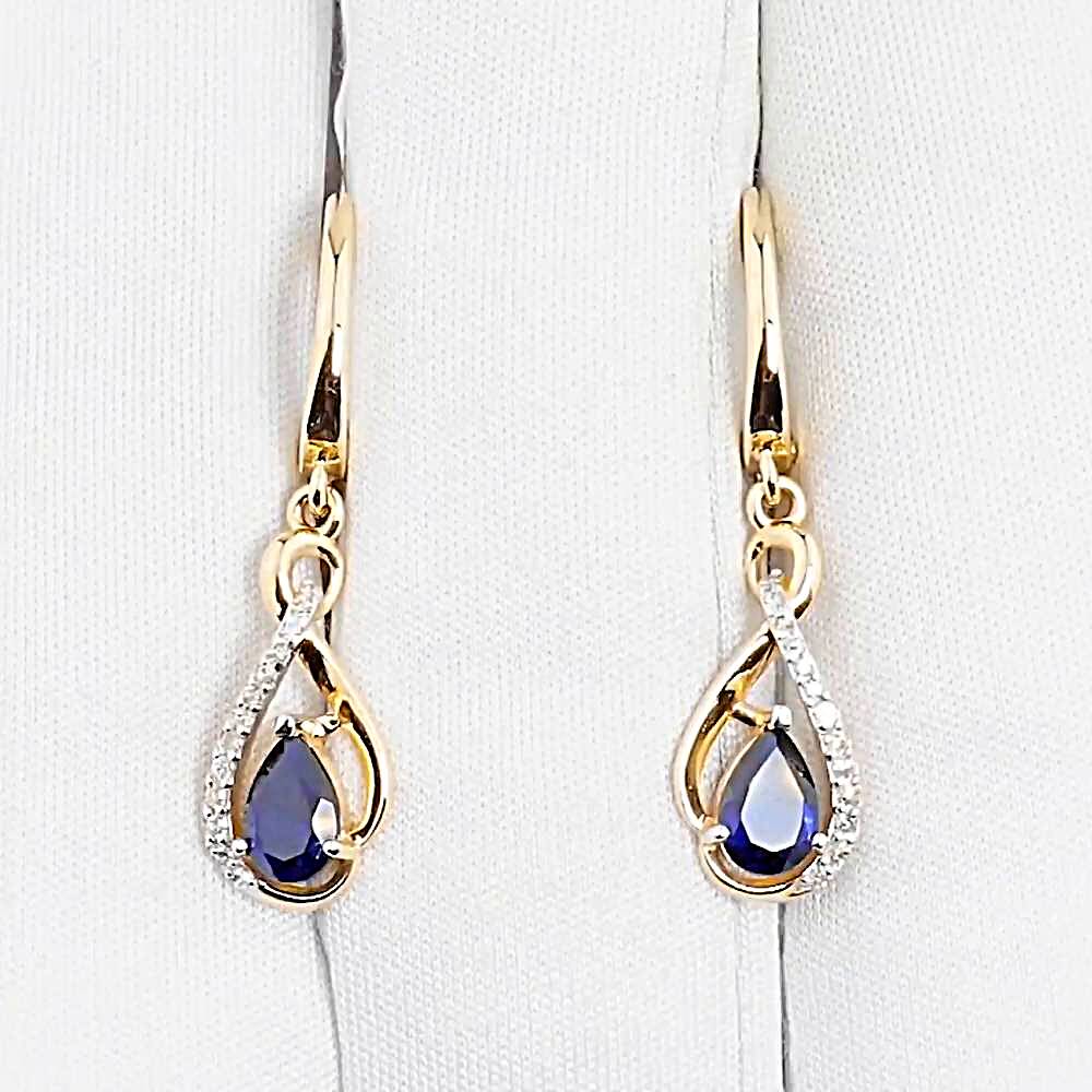 Серьги с сапфиром синтетическим и бриллиантами из красного золота 585 пробы Серьги с сапфиром синтетическим и бриллиантами из красного золота 585 пробы