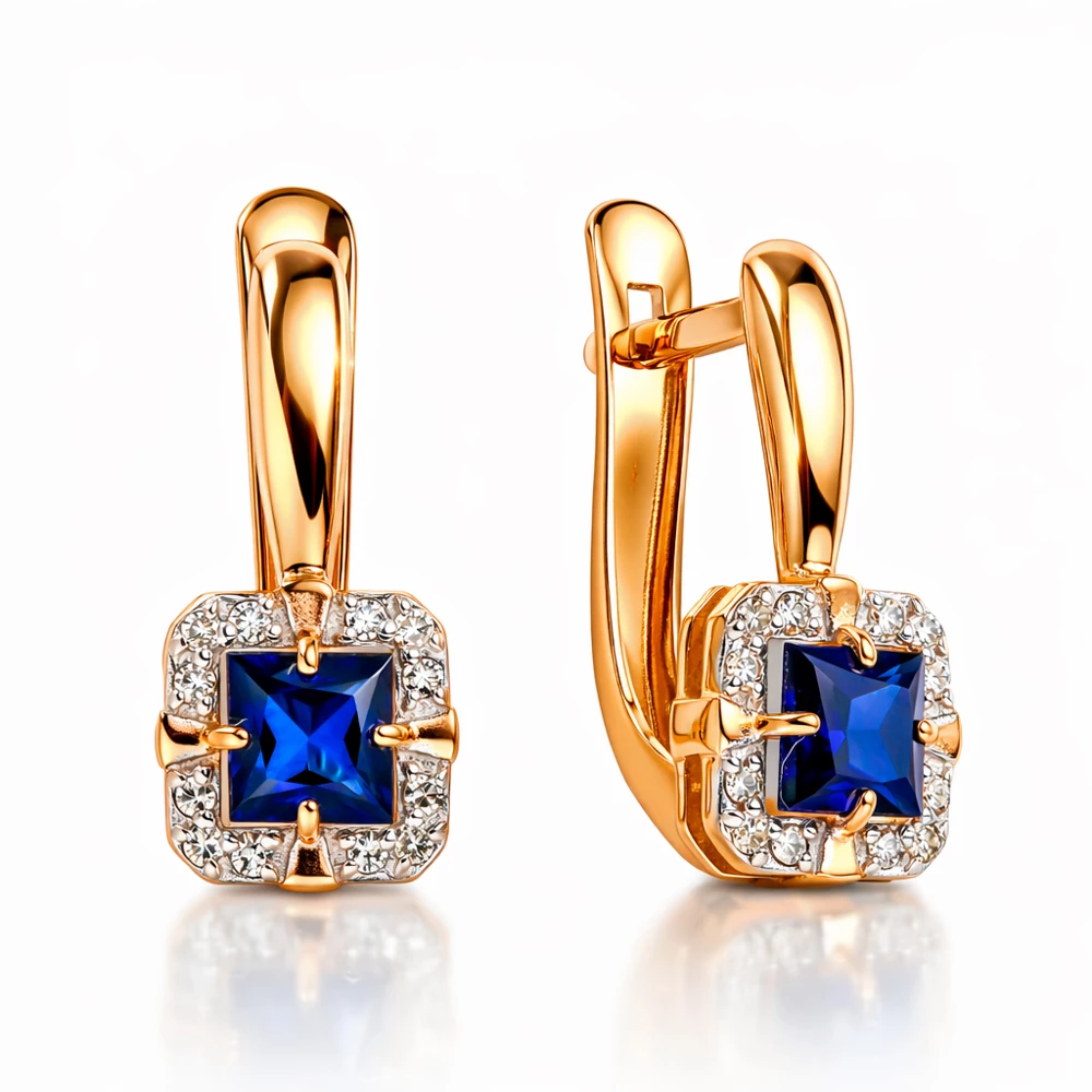 Серьги с сапфиром синтетическим и бриллиантами из красного золота 585 пробы Серьги с сапфиром синтетическим и бриллиантами из красного золота 585 пробы