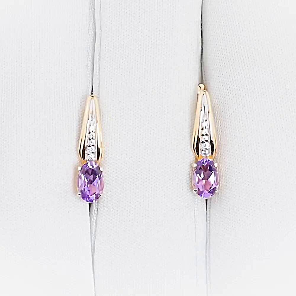 Серьги с аметистами и фианитами из красного золота 585 пробы Серьги с аметистами и фианитами из красного золота 585 пробы