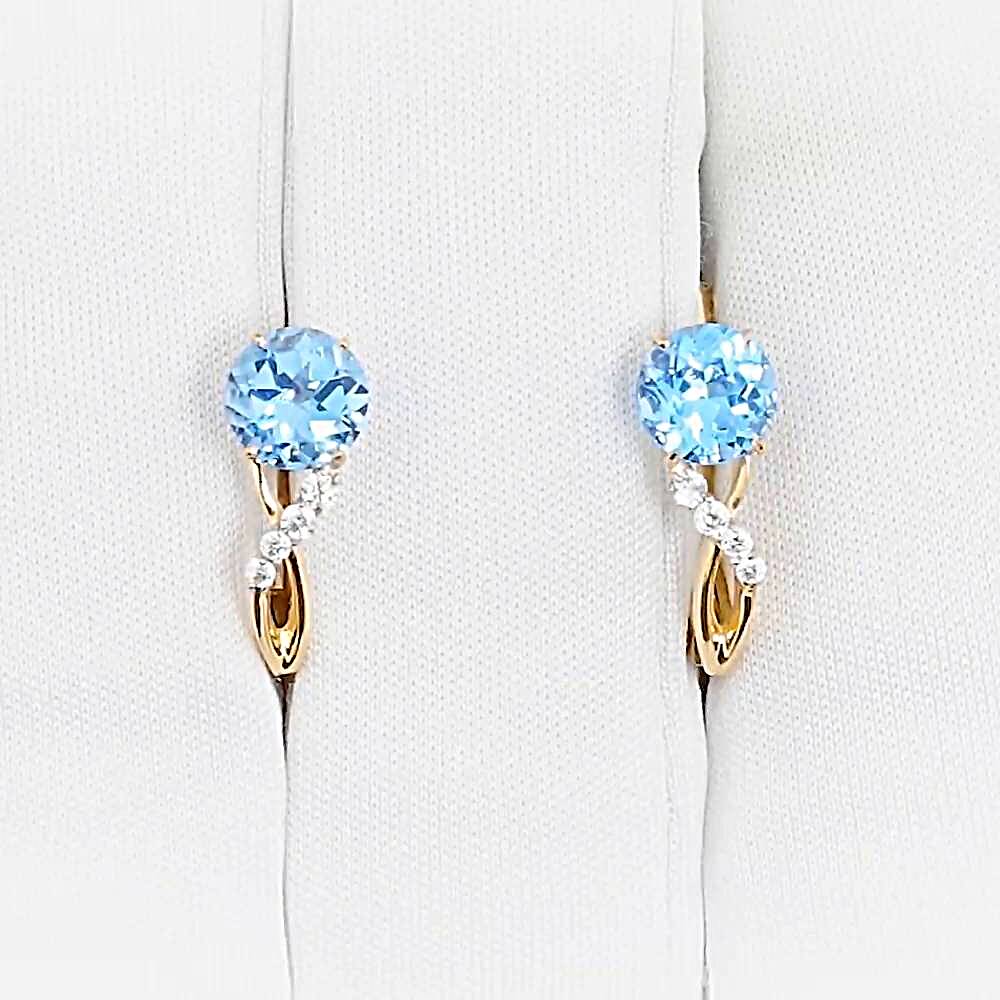 Серьги с топазами и фианитами из красного золота 375 пробы