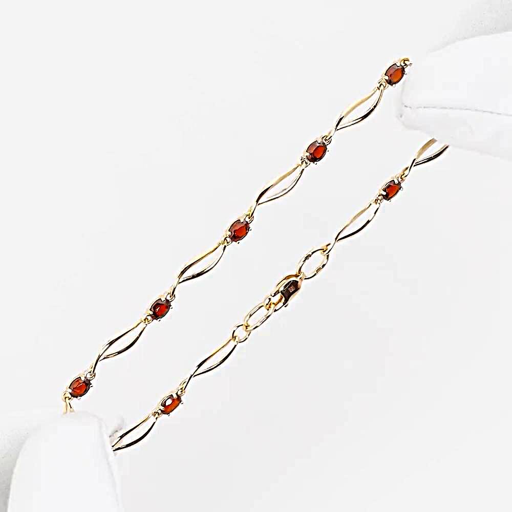 Браслет с гранатами из красного золота 585 пробы