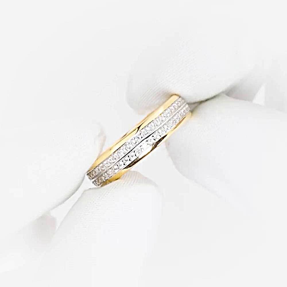 Кольцо обручальное с фианитами из комбинированного золота 585 пробы 1