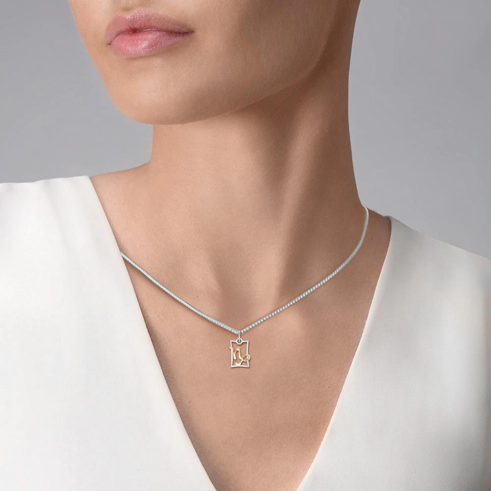 Подвес Козерог из комбинированного золота 585 пробы