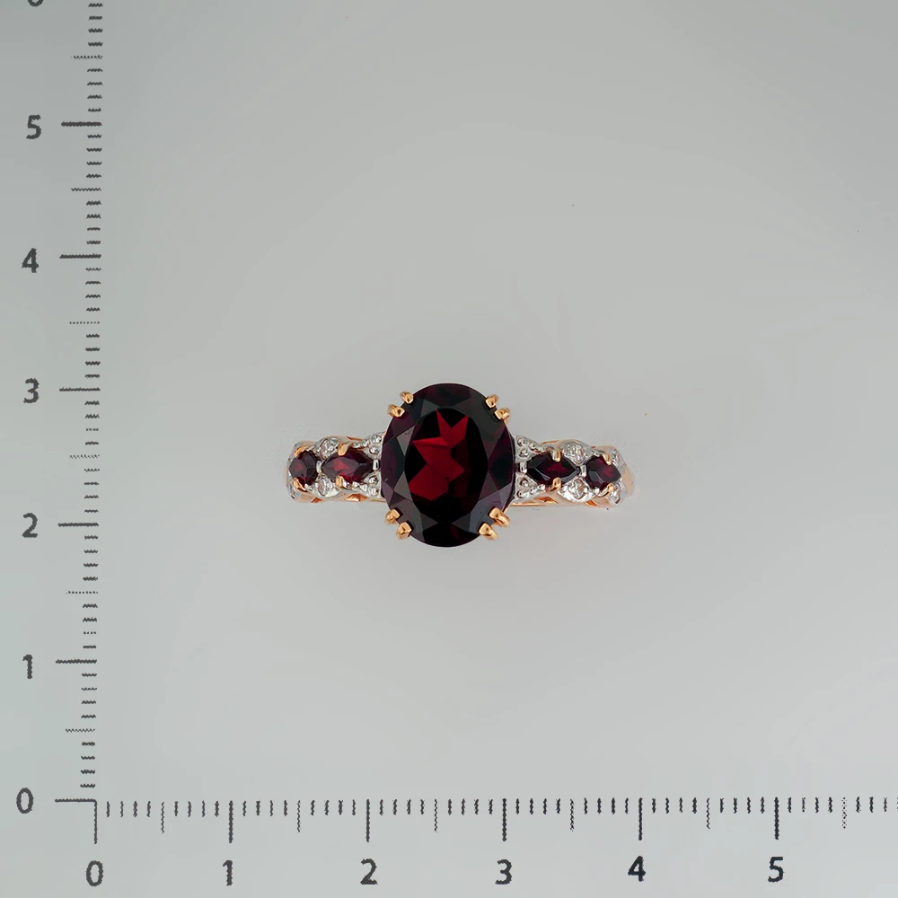 Кольцо с гранатом из красного золота 585 пробы