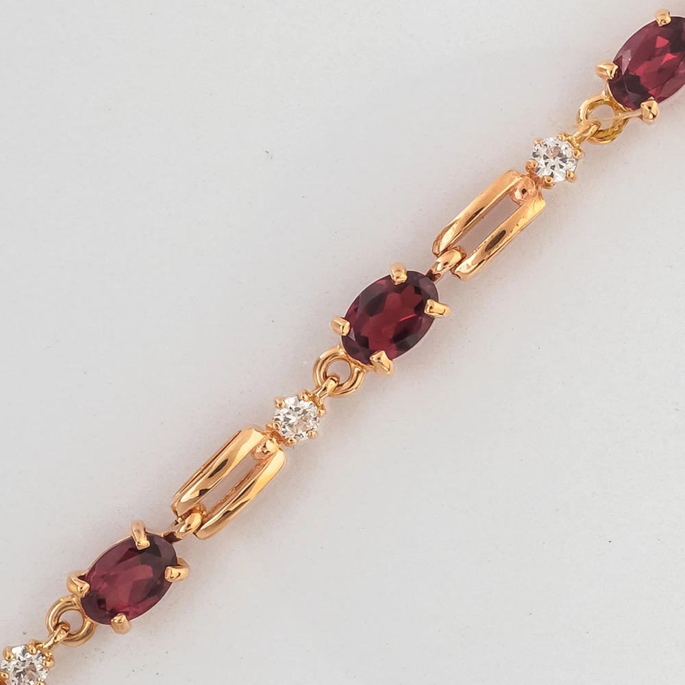 Браслет с гранатом из красного золота 585 пробы