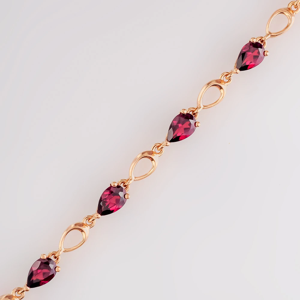 Браслет с гранатом из красного золота 585 пробы